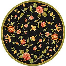 Hand hooked Garden Round Black Wool Rug (3 Round) (BlackPattern FloralMeasures 0.375 inch thickTip We recommend the use of a non skid pad to keep the rug in place on smooth surfaces.All rug sizes are approximate. Due to the difference of monitor colors,