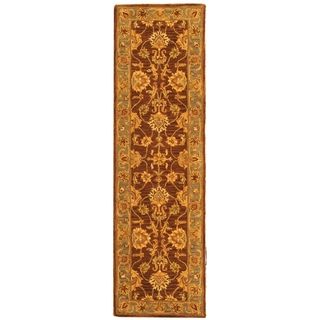 Handmade Heritage Kerman Brown/ Blue Wool Runner (23 X 10) (BrownPattern OrientalMeasures 0.625 inch thickTip We recommend the use of a non skid pad to keep the rug in place on smooth surfaces.All rug sizes are approximate. Due to the difference of moni