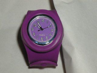 NEW PURPLE SLAP WATCH QUARTZ MOVEMENT PURPLE FACE ACTUAL NUMBERS 11" LONG FROM TIP TO TIP. 1 1/2" ACROSS FACE. 1 1/4" ACROSS ACTUAL FACE INCLUDING RIM. #8175 ON BACK FACE SLIPS OUT OF THE SILICONE BAND. I HAVE THE STEM PULLED OUT TO SAVE BAT