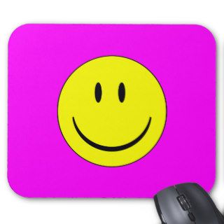 Bright pink smiley face mousepads