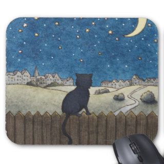 Cat on a fence looking at night sky above city mouse pads