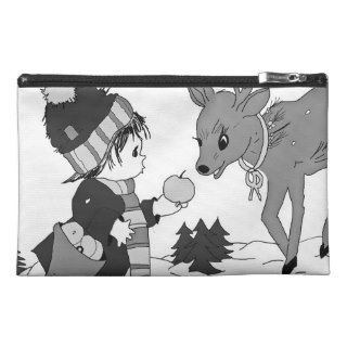 Little boy feeding reindeer in black and white travel accessory bags