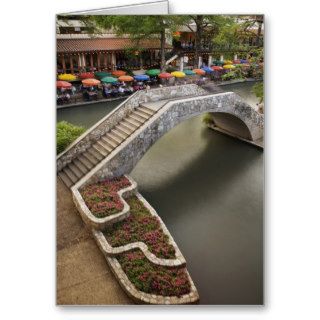 Outdoor cafe along River Walk and bridge over Greeting Card