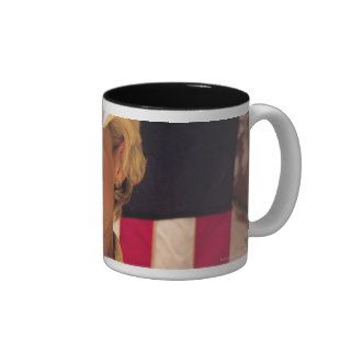 Woman with cowboy hat , American flag behind her Mug