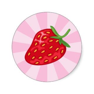 Red ripe strawberry on pink sunburst sticker