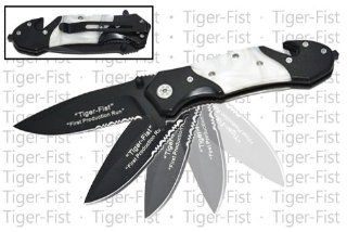 RS 911 B. 8" "Tiger Fist" Trigger Assisted Knife   White Pearl Jump into action with your fists swaying These Tiger Fist knifes are nothing to play with. The half serrated blade and the seat belt cutter and skull crusher folding knife blade