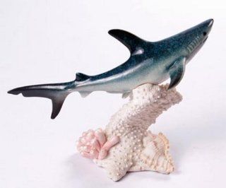 Blue Shark on Prowl Swimming Among White Coral with Shell  Statues  