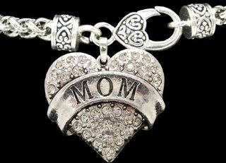 From the Heart Valentine's Day, Mother's Day, or any Day Clear Crystal Rhinestone Heart Bracelet. Dangling Charm with MOM engraved in the center Charm is approximately 1 1/2 inch long with Crystal Rhinestones Sparkling on Heavy Bracelet with a Hear