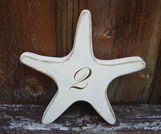 starfish table number by giddy weddings