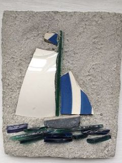 small boat with blue striped sail by wendy wilbraham