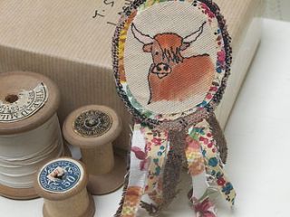 highland cow embroidered rosette brooch by samantha peare embroidered textiles