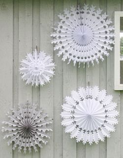 set of four paper snowflake decorations by petra boase