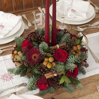 christmas fresh fir and flower centrepiece by the flower studio