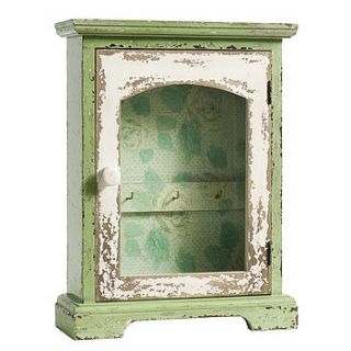 wallpapered distressed jewellery cabinet by out there interiors