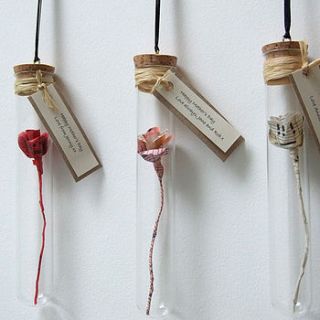 handmade paper rose in a glass vial by remade