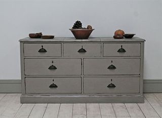 distressed painted bank of apothecary drawers by distressed but not forsaken