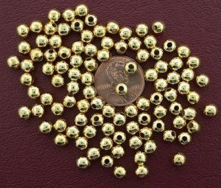 ONE HUNDRED 5mm GOLD PLATED ROUND BEADS  