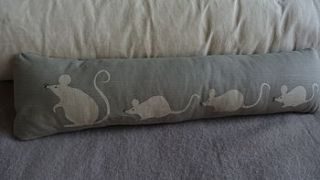 reversible hand printed mouse family bolster by helkatdesign