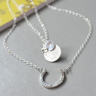 love and luck silver horseshoe necklace by nina louise