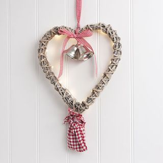 light up hanging wicker heart wreath by the contemporary home