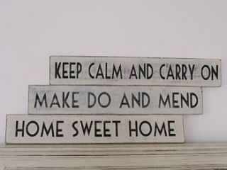 wooden quote sign by the chic country home