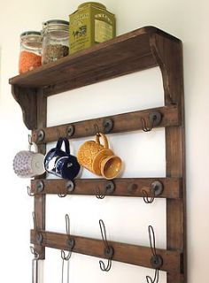 wooden wall shelf with hooks by the forest & co