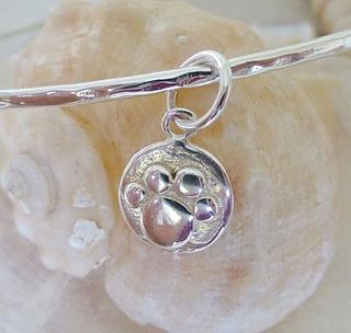 silver paw print charm bangle by anne reeves jewellery