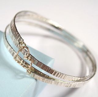hammered spiral bangle with gold heart by angie young designs