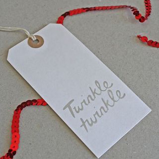 pack of eight 'twinkle' christmas tags by the design conspiracy
