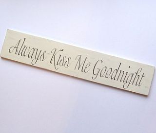 large 'always kiss me goodnight' sign by the painted broom company