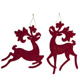 red flock reindeer christmas decoration by the contemporary home
