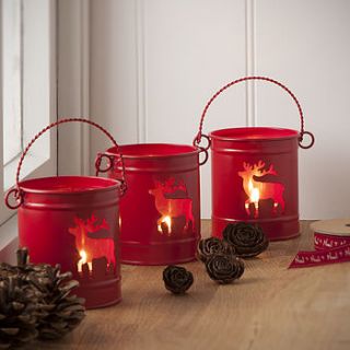 red tea light bucket lantern by the contemporary home