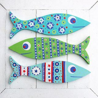 wooden fish decorations by half an acre