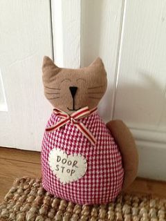 country style cat door stop by the hiding place