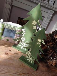 green wooden christmas tree by the hiding place
