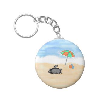 Cat Curled up On The Beach Key Chains
