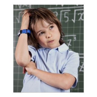 portrait of young boy in classroom in front pof print