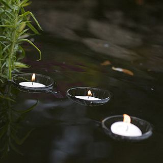set of three floating tealight holders by le trousseau