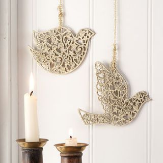 pair of gold christmas doves by the contemporary home