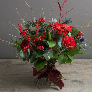 festive berry and flower bouquet by the flower studio