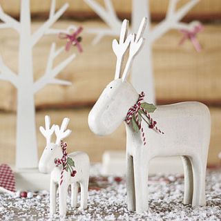 wooden carved reindeer by beautiful day
