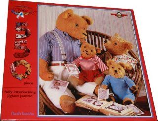 ceaco 550 Piece Puzzle   Bialosky & Friends   Flash Backs   Features The Bears Looking Through and Old Family Photograph Album While Sitting on a Wicker Chair Toys & Games