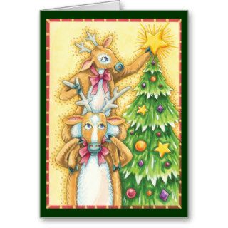 Cute Reindeer Putting a Star on a Christmas Tree Cards