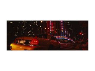 Car on a road, Radio City Music Hall, Rockefeller Center, Manhattan, New York City, New York State, USA Print by