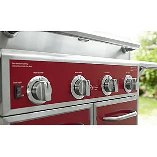 Kenmore Red 4 Burner Gas Grill With Folding Side Shelves and lit knobs