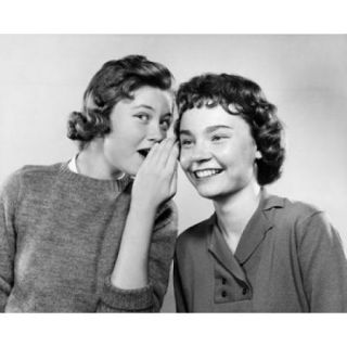 Portrait of a teenage girl whispering to another teenage girl Poster Print (18 x 24)